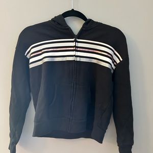 Black zip up hoodie with white and pink stripe